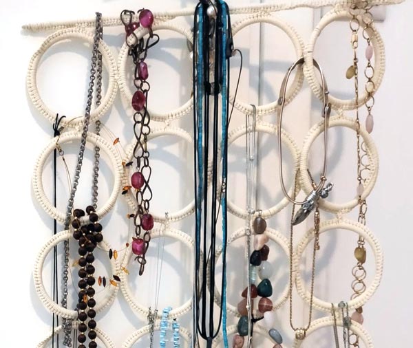 An IKEA scarf hanger used for hanging faux jewelery.