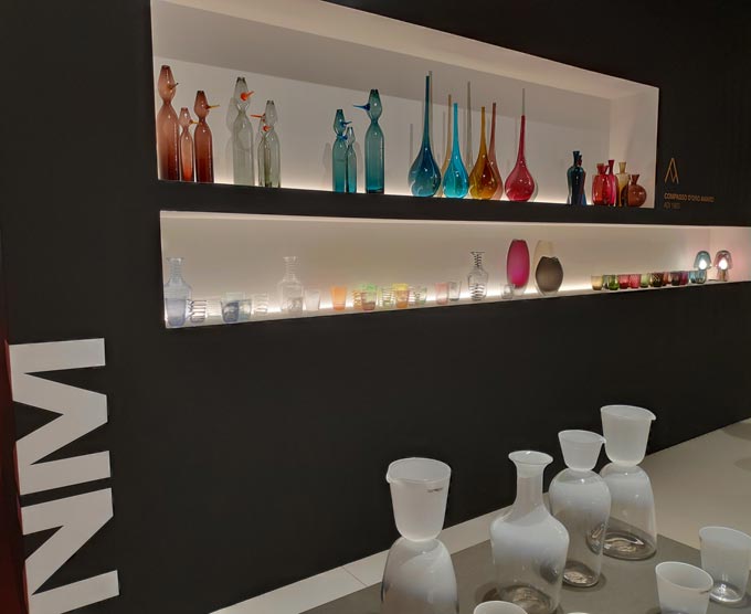 Display of colored Murano glassware at iSaloni 2019 in Milan.