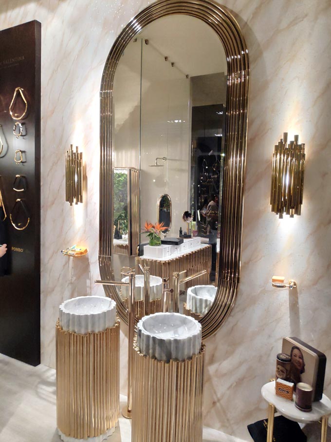 A luxurious bathroom with two round washbasins from Maison Valentina at iSaloni 2019 in Milan.