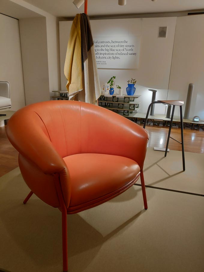 A rusty toned leather armchair by a Spanish designer during Milan's Design Week.