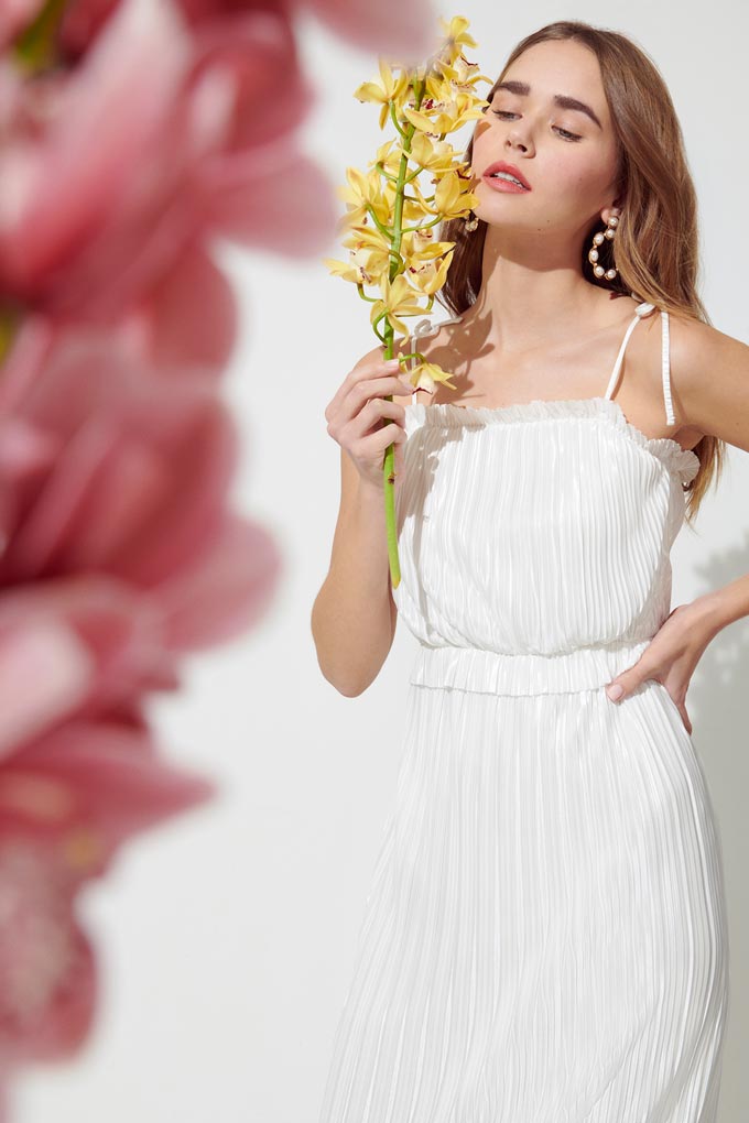 A beautiful white dress with soft pleats and spaghetti straps. Image by Miss Selfridge.