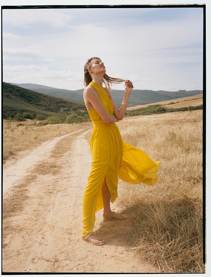 A maxi yellow summer dress like this is bound to make heads turn and looks amazing with when paired with flat sandals like these ones. Image by Monsoon.