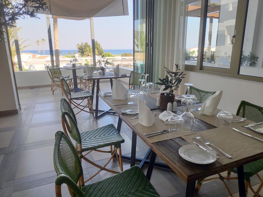 Partial view of the Olive Grove restaurant at Grecotel Lux Me Rhodos hotel.