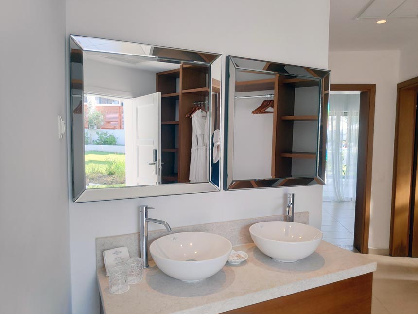 The vanity with a double mirror and double sink as found in a corridor between the newly renovated bungalow of Grecotel Lux Me Rhodos.