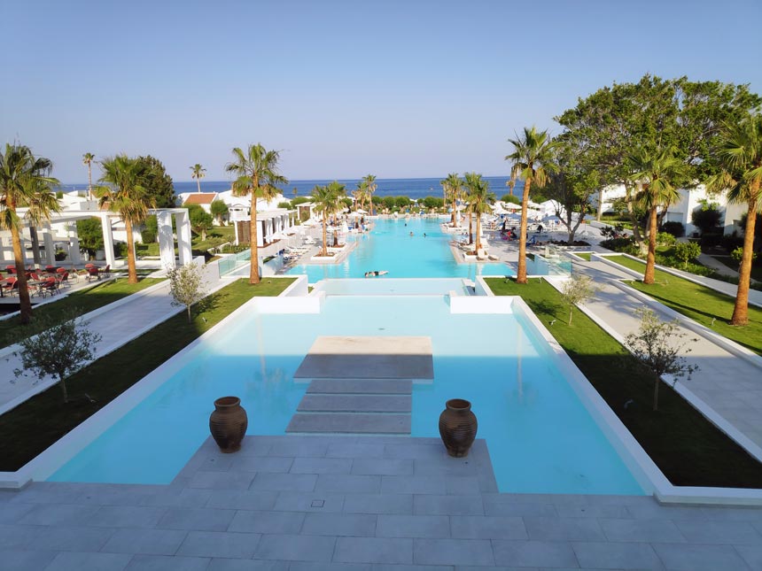 View of the large swimming pool of Grecotel Lux Me Rhodos.