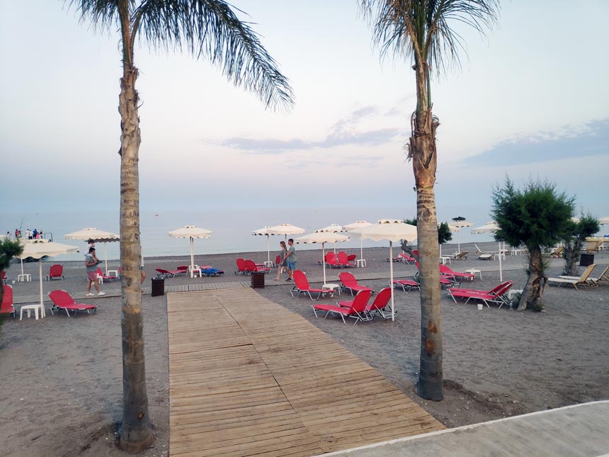 Partial view of the sandy beach in front of Grecotel Lux Me Rhodos.