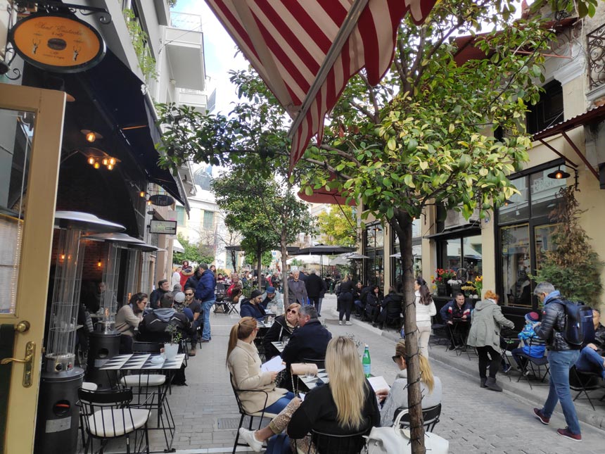 People having coffee, a popular pastime in Athens, outdoors downtown Athens, Greece.