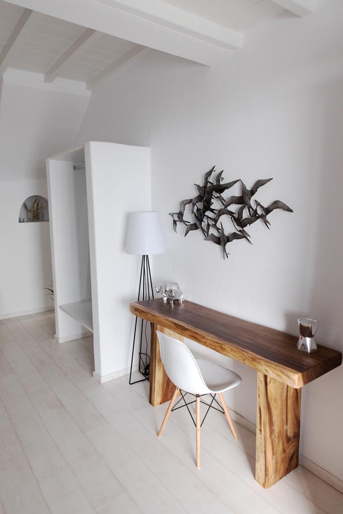 A Cycladic minimal white bedroom at Bellou Suites in Mykonos.