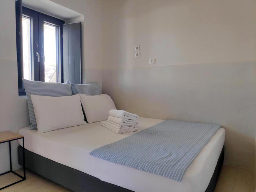 View of a ground floor double bedroom at Hotel Emily in Syros