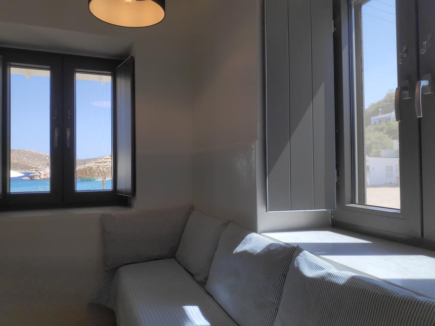 Cycladic minimal style: Partial view of the sofa bed of a triple bedroom at Hotel Emily in Syros.