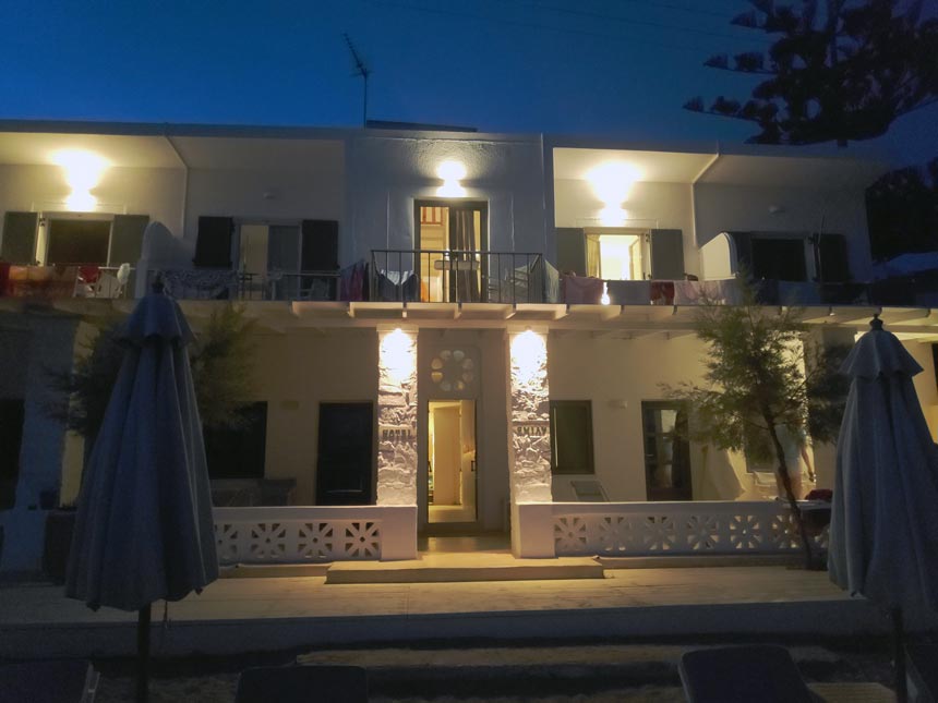 Cycladic minimal style: View of the external facade of Hotel Emily in Syros after sunset hours.