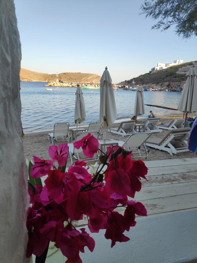 Looking at the beach front with the aligned sunbeds of Hotel Emily.