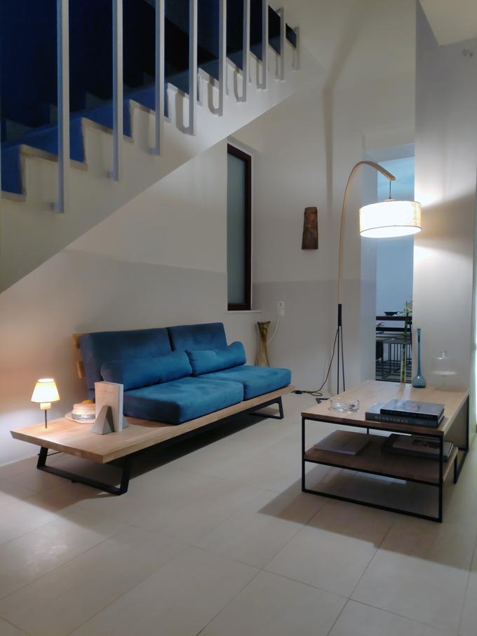 Another view of the tiny reception lobby with that blue custom made sofa and coffee table at Hotel Emily.