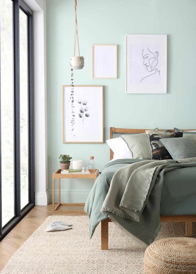 Tranquil dawn color of the year 2020: A stylish bedroom in a pastel green hue and an serene and tranquil vibe to it. Image by Furniture Choice Ltd.