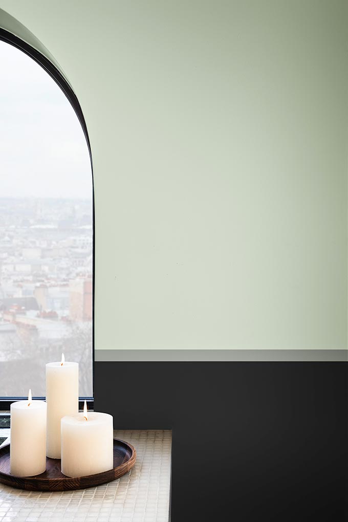 Detail of an arched window on a wall painted in DULUX Tranquil Dawn. The new color of the year for 2020. Image by DULUX.