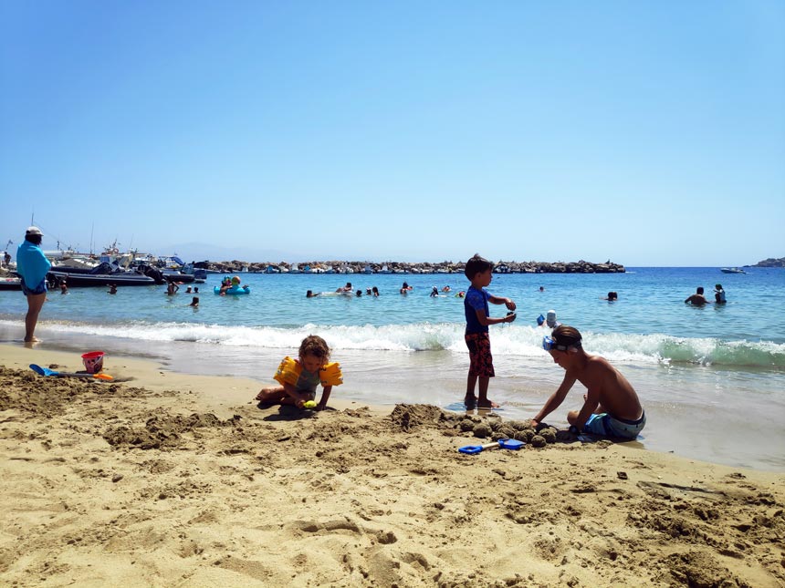 Kids playing on a beach.