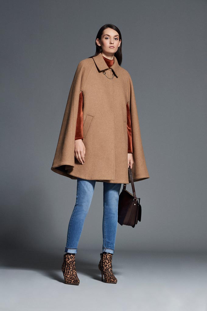 Winter outfits lookbook: A camel cape coat paired with skinny jeans and leopard print booties. Image via Debenhams.