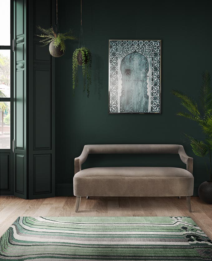 I love this marble like green rug in front of a grey velvet sofa. The dark green wall in the background acts like the perfect backdrop. Image via Rug Society.