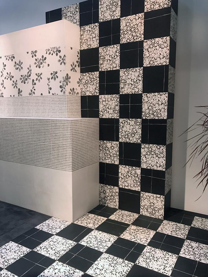 An exhibition installation with tiles of different patterns as seen at Cersaie 2019 by Mutina.