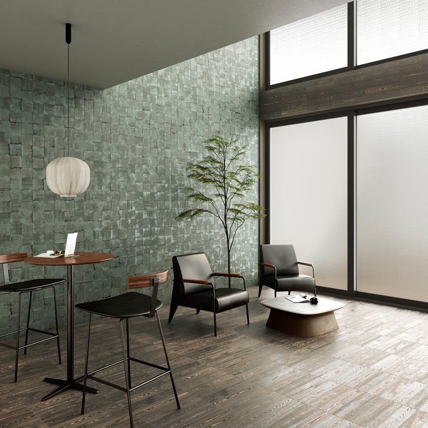 A contemporary space with double height from a point onwards, large windows from floor to ceiling and a green tiled accent wall. Image via WOW Design.