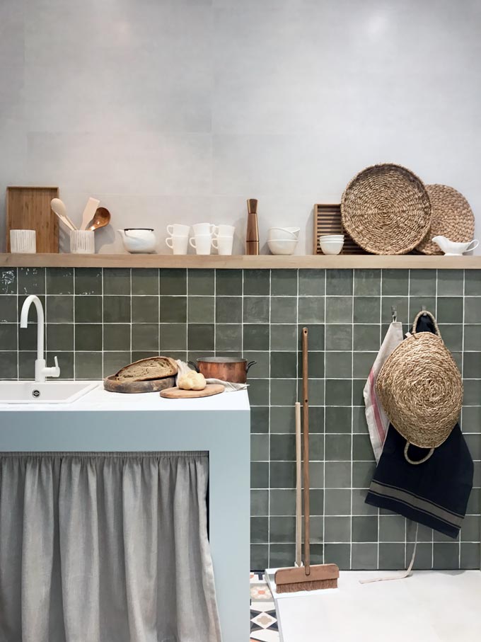 A kitchen installation by Roca at Cersaie 2019 with green Zellige tiles.