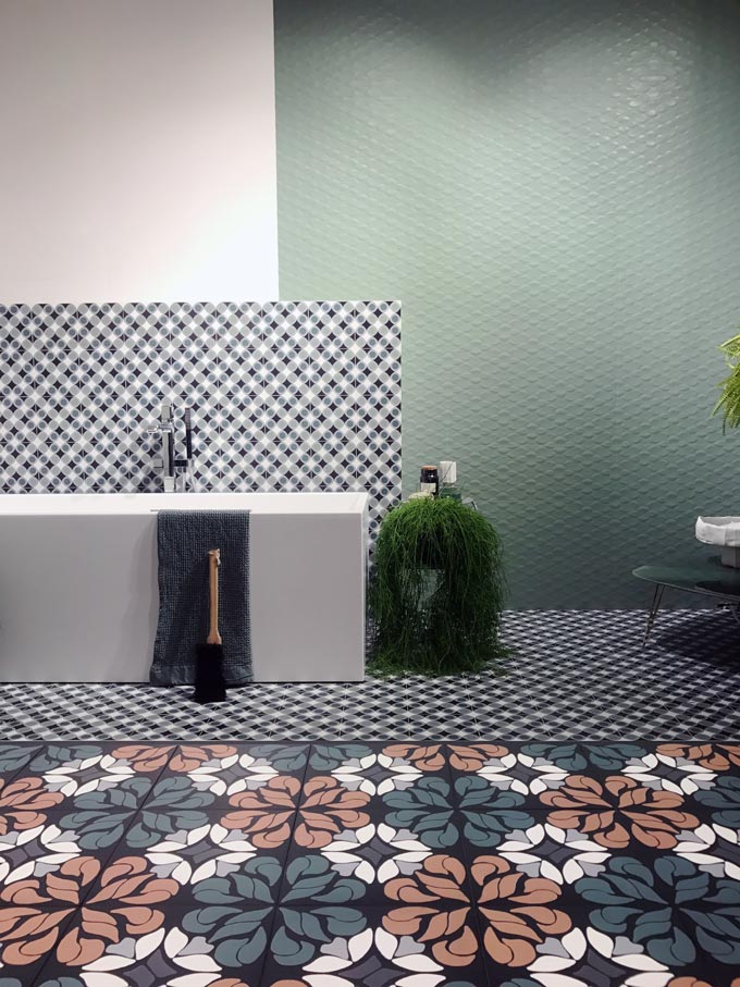 View of a tile exhibition booth at Cersaie 2019 from Santagostino with lots of patterned tiles.