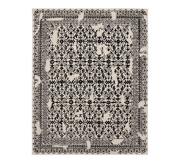 A black patterned rug with a boho flair. Image via Pottery Barn.