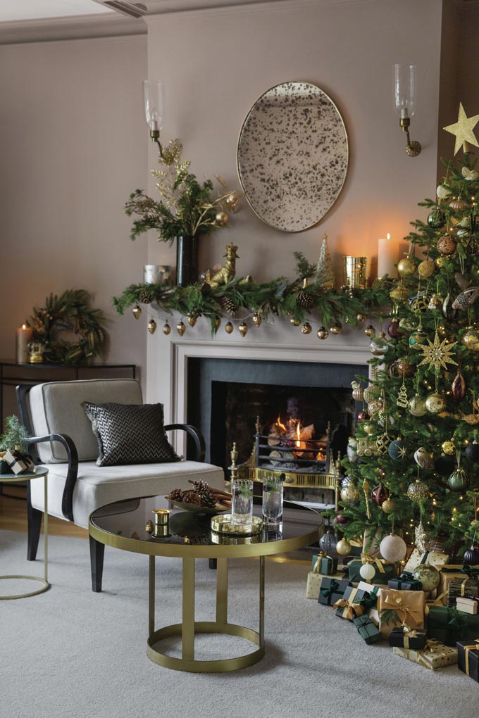 How timeless is the all gold decoration on a green Christmas tree? Image via Amara.