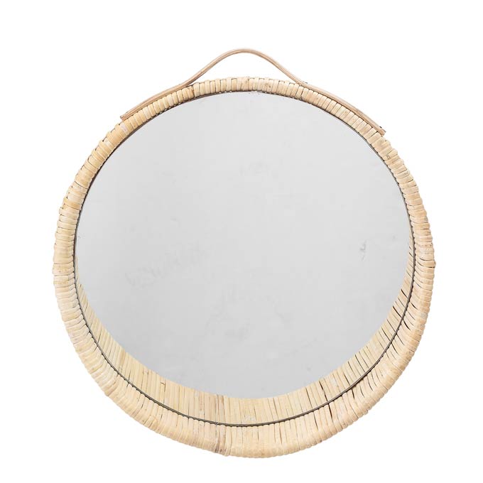 A cut image of a round mirror with a rattan frame. Image via Cult Furniture.