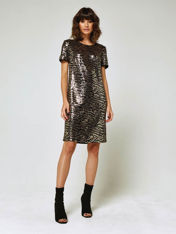 A short sleeve knee high dress with sequins in a zebra inspired pattern - perfect for the holidays. Image via M&Co.