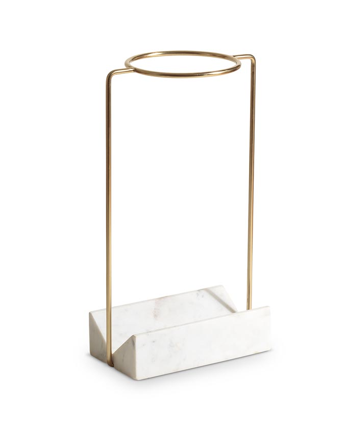 An umbrella stand with a white marble base from Oliver Bonas. Marble decor ideas.