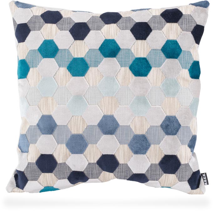 A decorative pillow with a pattern in various shades of blue and white. Image via H.O.C.K.