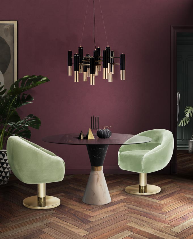 The Ike suspension lamp complimenting those neo-mint velvet armchairs with a blueberry toned accent wall in the background. WOW! The neo-mint is another design trend on the rise in 2020. Image by DelightFULL.