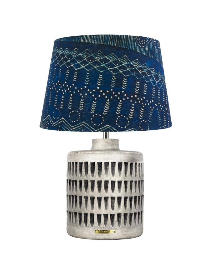 A cone shape shade in blue with a patterned base table lamp by Mind the Gap.