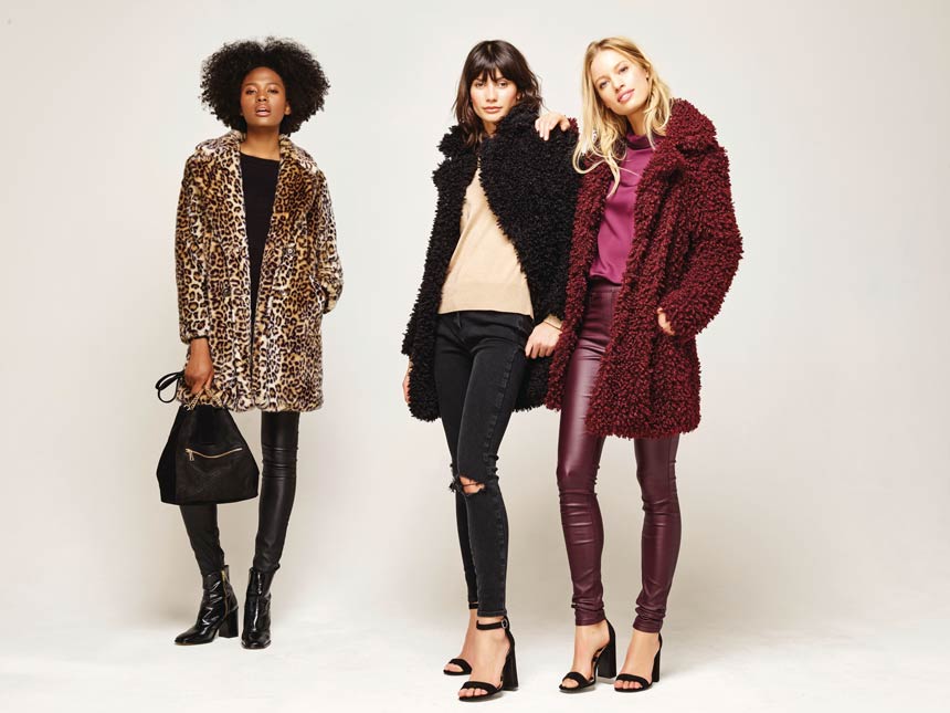 Three women in winter outfits featuring a leopard coat and two teddy coats. Image via M&Co.