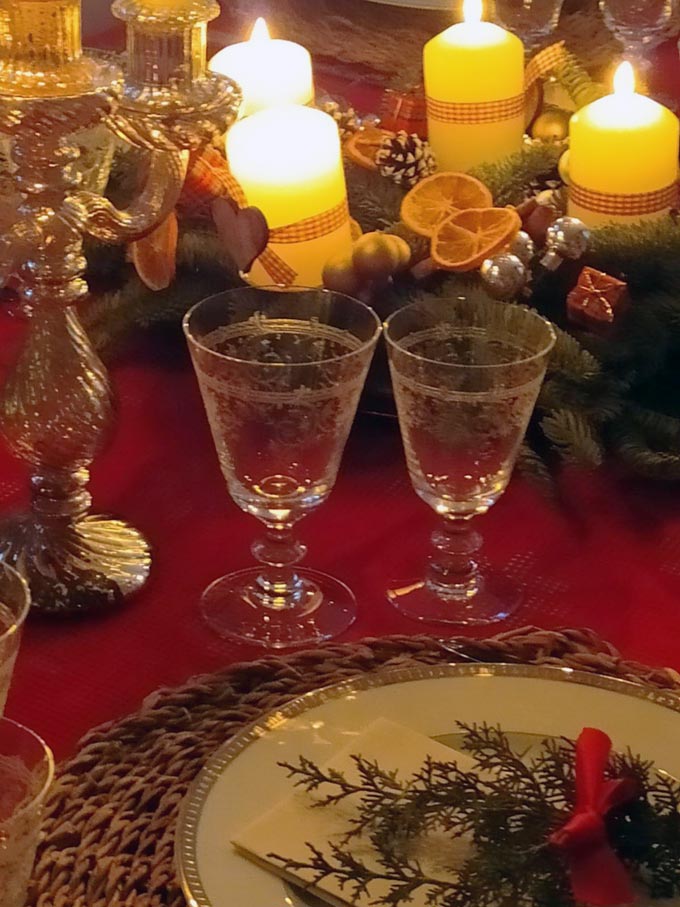 Looking closer at a Christmas table setting with an Advent wreath as the centerpiece.