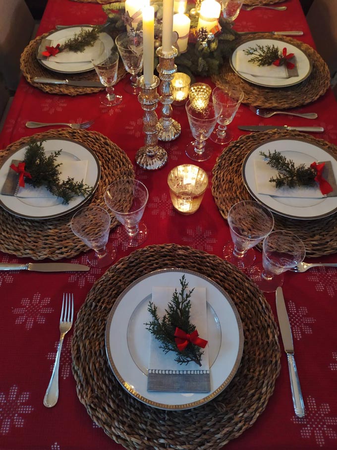 Looking down at a beautiful Christmas table setting.