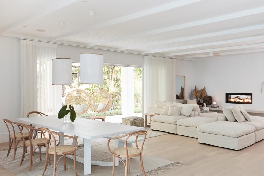 House Tour: Such a stylish all white open space interior. The dining and sitting area shown here. Photo: Three Birds Renovations/Raja Homewares.