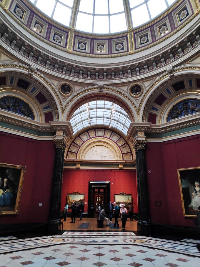 Inside one of the halls of the National Gallery in London and looking through the halls to capture the depth of the Gallery.