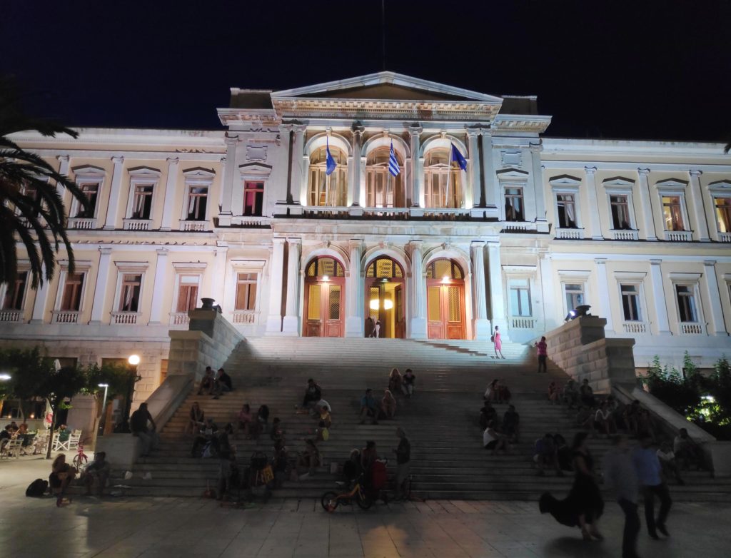 The Town Hall of Hermoupolis in Syros at night, pictured with a smartphone. In this image the stairs appear more.