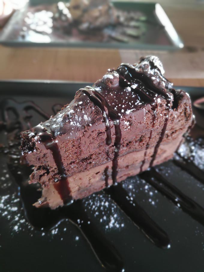 A picture of a chocolate cake in portrait mode using a smartphone.