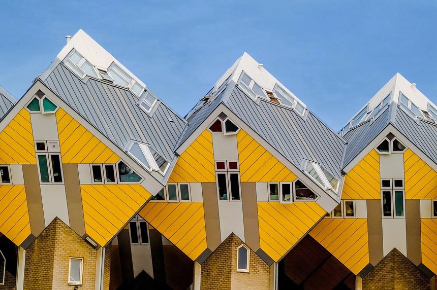 Closer view at three Cubic Houses with their distinctive yellow zinc cladding, found at Rotterdam, Netherlands.