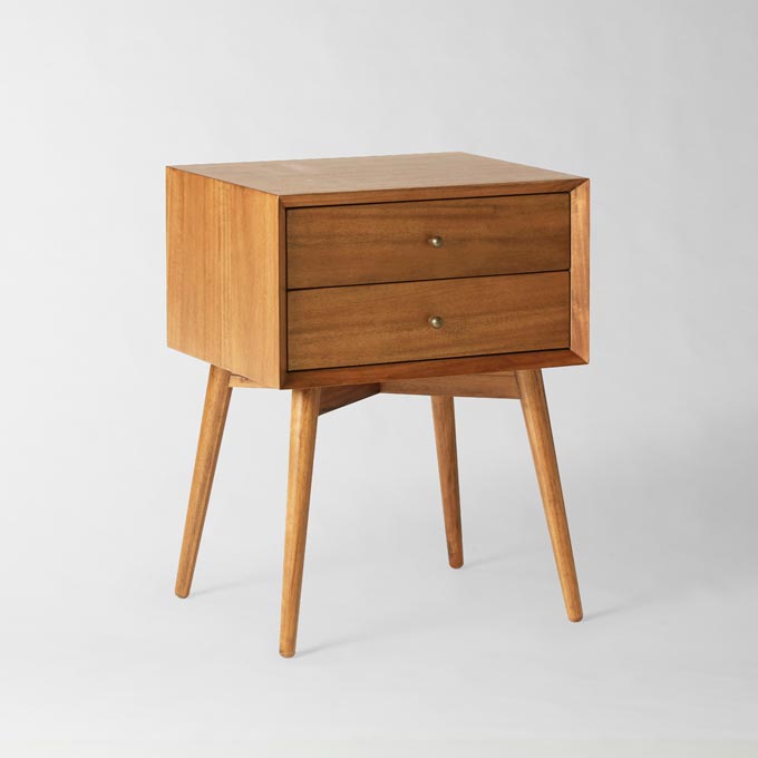A stylish wooden Mid Century nightstand. Photo credit: West Elm.