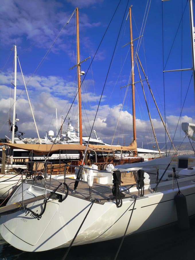 Sailing boats and yachts docked at a marina.