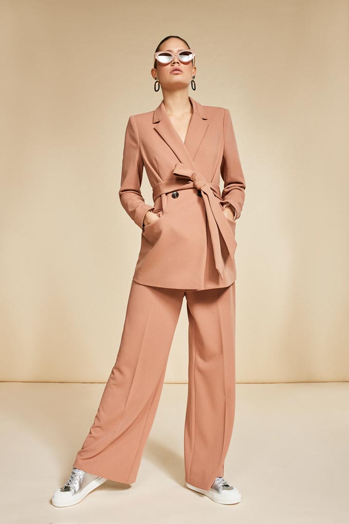 A caramel hue power suit styled with trainers - casual but fashionable too. Image: Debenhams.