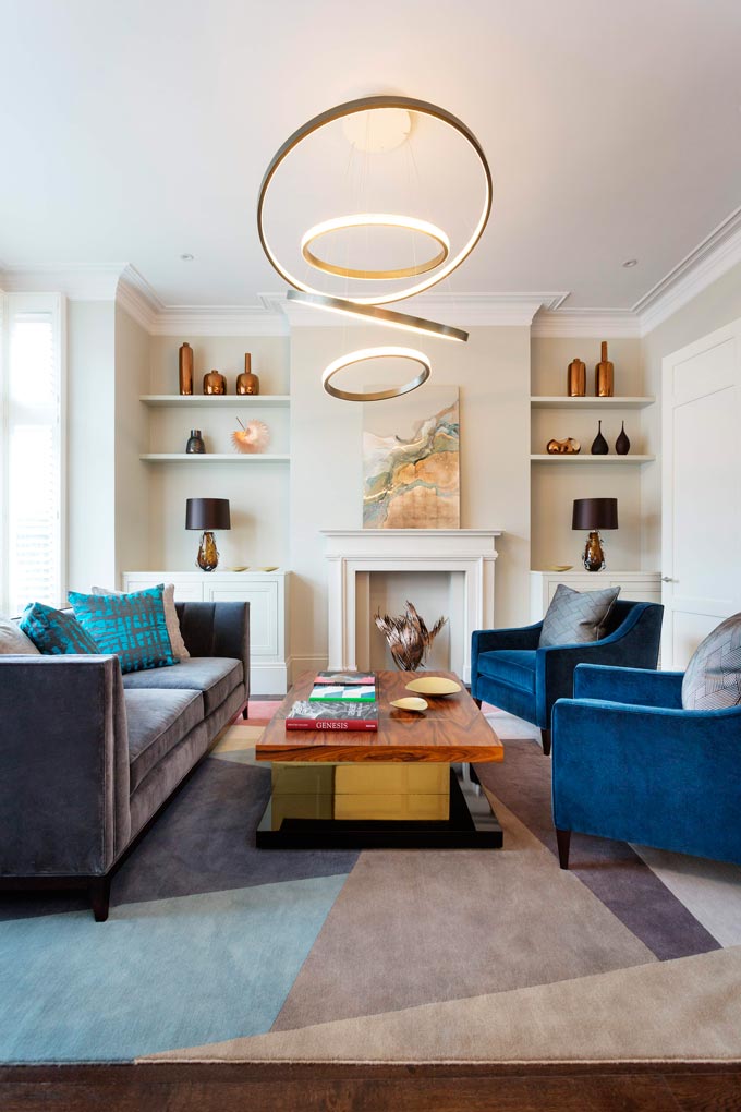 A bright and colorful contemporary living room with a distinct modern British flair. Designed by Zulufish. Image credit: Brabbu Design Forces.