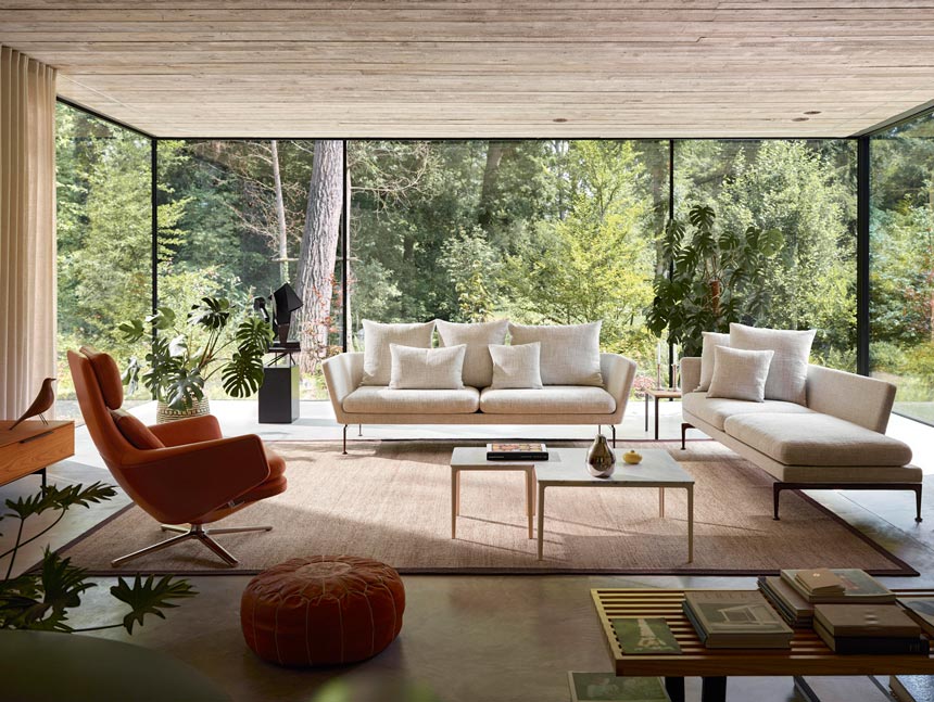 A contemporary bright living room with an amazing garden view thanks to the floor to ceiling bay windows. Image: Nest.co.uk.