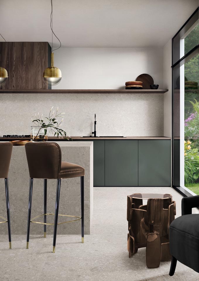 A minimal contemporary kitchen with dark wood stain upper cabinetry, muted fir green lower cabinetry and terrazzo. Fantastic. Image: Brabbu Design Forces.