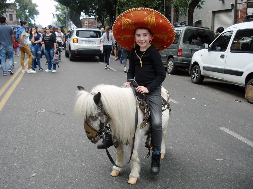 Michael on a falabella horse during the Feria de Mataderos.