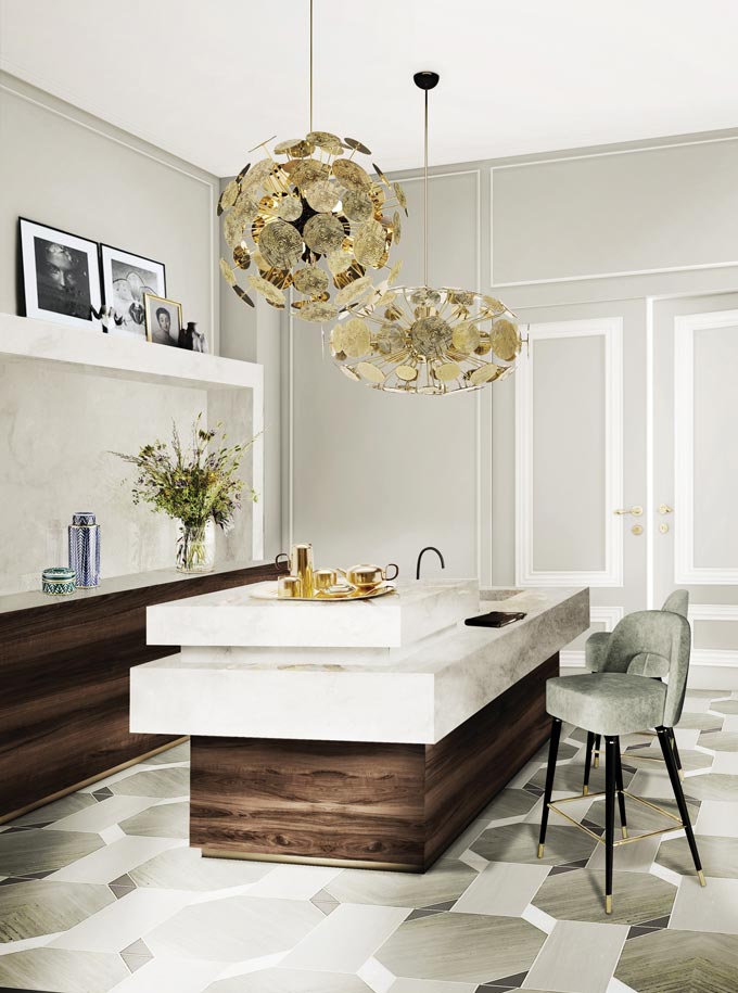 A stunning kitchen in a Paris apartment in earth tones with dark stain wood cabinetry. Image: Covet House.